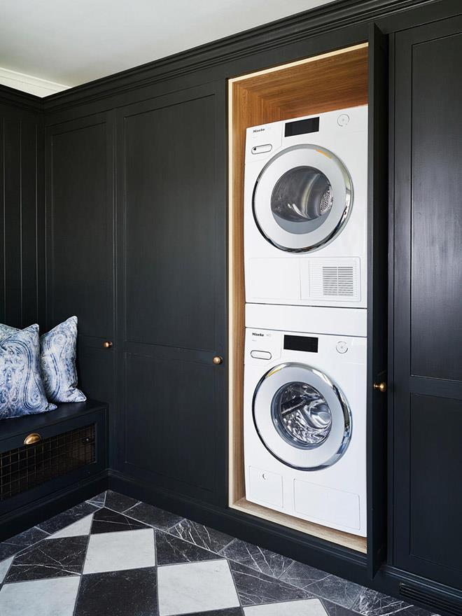 The Miele washing machine and dryer are tucked neatly into custom joinery beside. The neighbouring bench seat is an exceptionally stylish spot for kicking off the RM's after a long day on the farm in [Steve Cordony's luxe kitchen](https://www.homestolove.com.au/steve-cordonys-luxe-country-kitchen-at-rosedale-farm-21256|target="_blank").