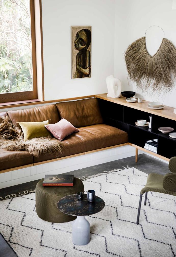 In the second living room of this [nature-inspired home in Riverview](https://www.homestolove.com.au/nature-inspired-house-riverview-20198|target="_blank") a more relaxed approach to design and furnishing was taken. A built-in leather couch is the perfect place to lounge, and a built-in sideboard provides ample storage space. <br><br>