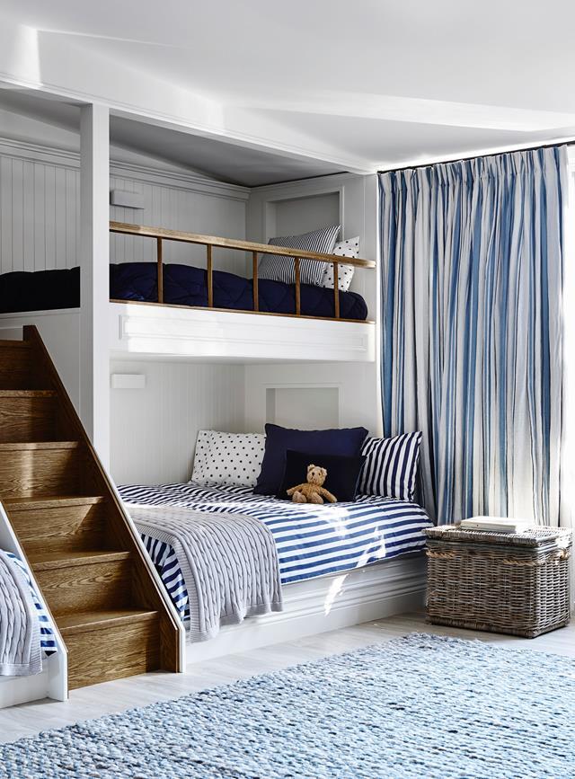 A [built-in bunk bed](https://www.homestolove.com.au/bunk-bed-ideas-21129|target="_blank") creates a seamless look in this coastal cool shared kids room. The bottom bunk is large enough to accomodate a double bed and the built-in staircase helps to tie the space together.