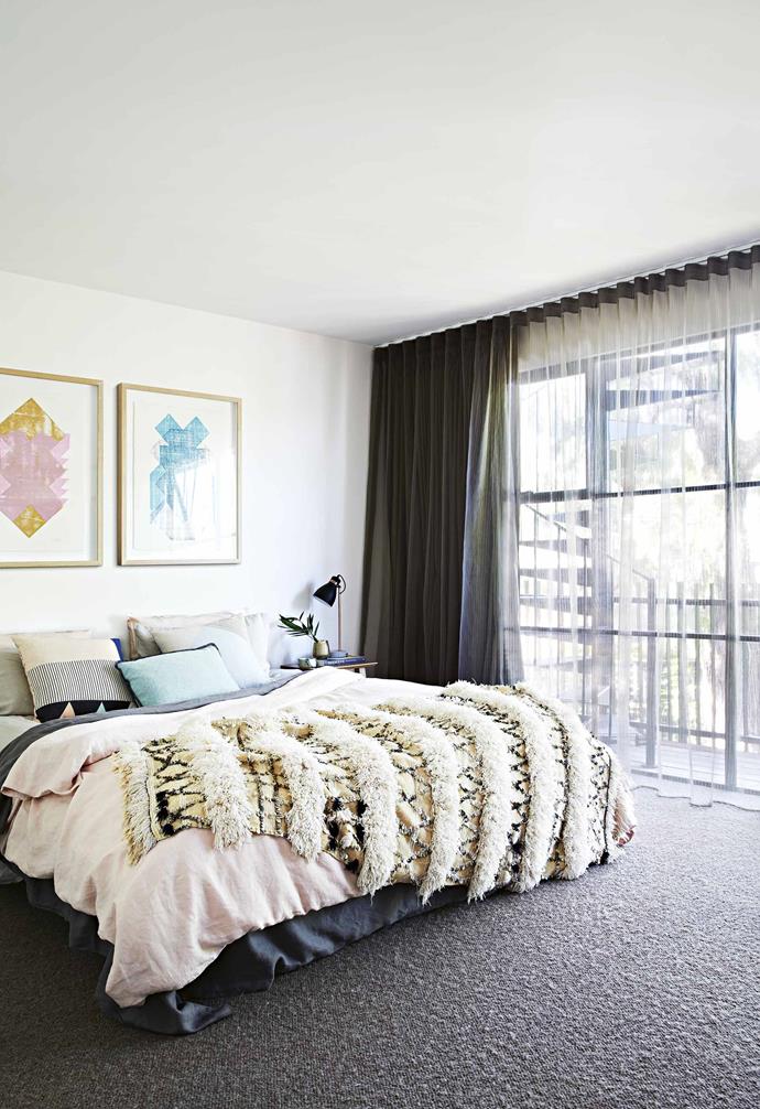 The ground floor was completely transformed with a kitchen, [butler's pantry](https://www.homestolove.com.au/butlers-pantry-checklist-15378|target="_blank"), meals area, sunken lounge and [powder room](https://www.homestolove.com.au/powder-room-ideas-17987|target="_blank"), while another floor was added above to take in those long-awaited views of the water with a [rooftop garden](https://www.homestolove.com.au/rooftop-gardens-2933|target="_blank") and parents' retreat.<br><br>**Master bedroom** Perched on the top floor, Martin and Doreen's bedroom is their little private oasis. A Moroccan wedding blanket from [Society Of Wanderers](https://societyofwanderers.com/|target="_blank"|rel="nofollow") is the centrepiece, while Lisa Lapointe cushions complement the artworks from [Greenhouse Interiors](https://greenhouseinteriors.com.au/|target="_blank"|rel="nofollow"). Bedlinen, [Cultiver](https://cultiver.com.au/|target="_blank"|rel="nofollow"). Lamp, [Crate Expectations](https://www.crateexpectations.com.au/|target="_blank"|rel="nofollow"). Lumiere Art + Co Artwork, [Greenhouse Interiors](https://greenhouseinteriors.com.au/|target="_blank"|rel="nofollow").