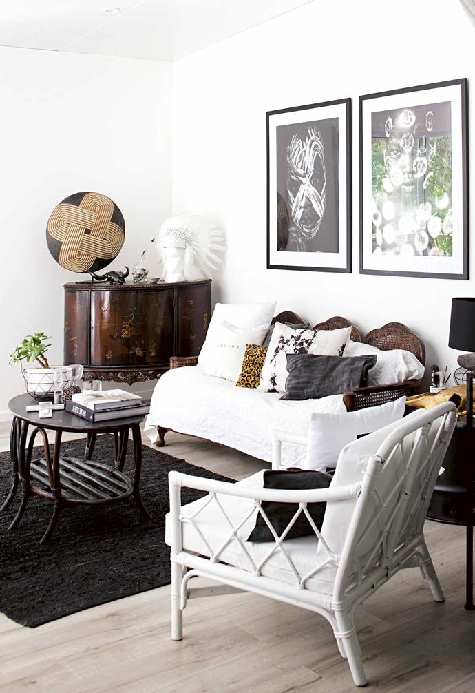 **Living area** The antique walnut and cane sofa was inherited from Lara's great-grandmother. The black cane table was a garage sale find; Lara hasn't had time to update it, but likes it unfinished. Lara mixed garage sale finds with family heirlooms to personalise her space.