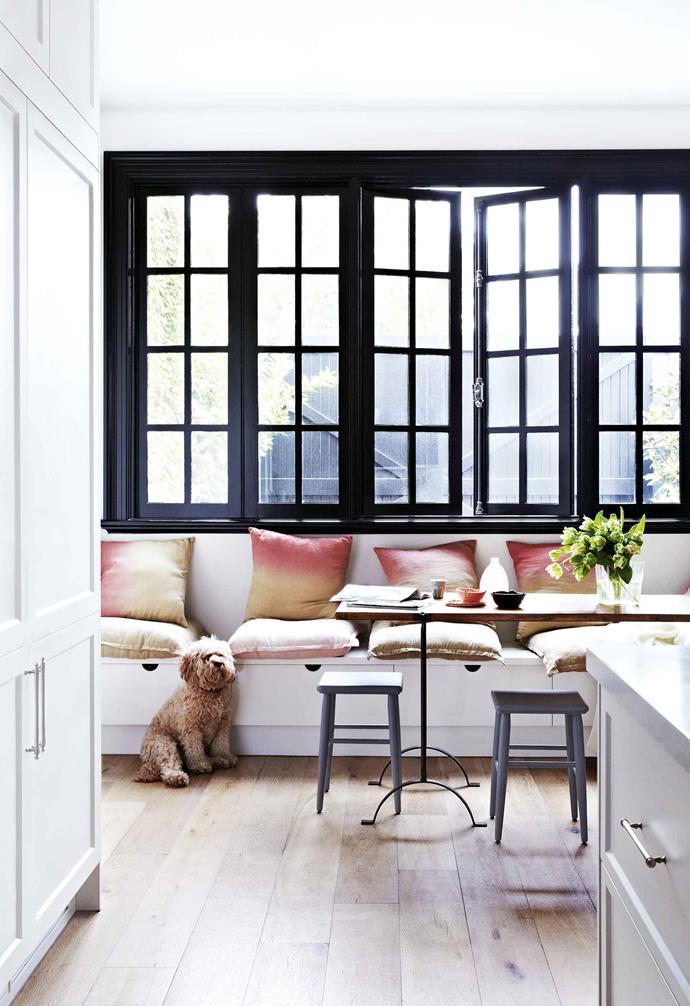 [This 1880s Victorian home was given a French provincial inspired update](https://www.homestolove.com.au/french-style-victorian-home-17810|target="_blank") with the windows in the kitchen and dining space making a bold statement. The black-framed windows add a dramatic contrast to the mostly-white palette in the rest of the room.
