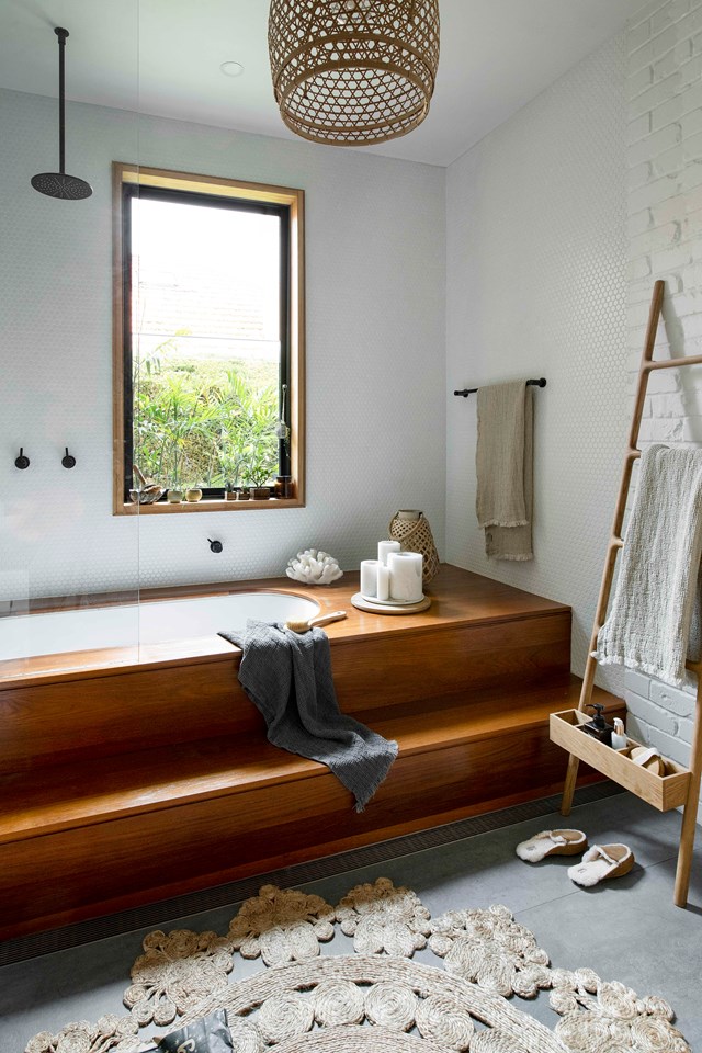 A far cry from your typical wet zone, [this eclectic bathroom](https://www.homestolove.com.au/eclectic-cottage-sydney-21653|target="_blank") enjoys the feel of a luxury eco resort, courtesy of its reliance on timber (marine teak to prevent water damage) and natural textures. The choice of black tapware echoes the window frame and keeps things contemporary.  *Photo: Brigid Arnott / Styling: Lisa Hilton / Story: Home Beautiful*