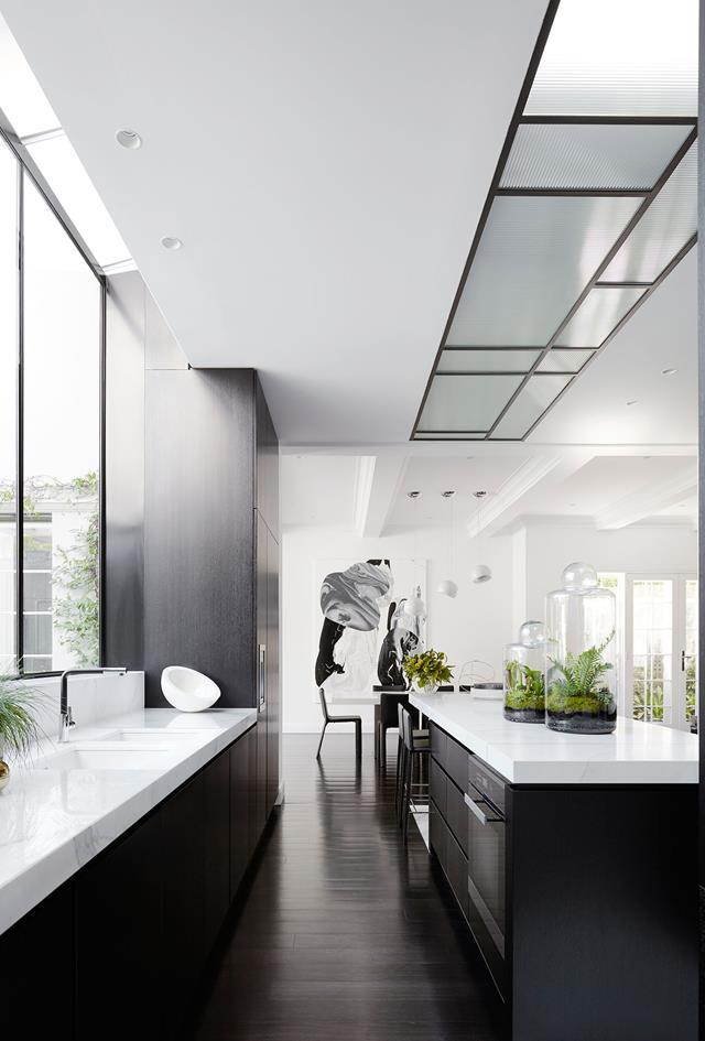 SJB's chic black and white design scheme for this [Melbourne home](https://www.homestolove.com.au/monochromatic-home-melbourne-toorak-6270|target="_blank"), complete with bespoke fittings and luxe finishes, took it to another level of sophistication. The most significant architectural work was done at the rear, with a long kitchen designed as a showpiece to entertain family and friends.