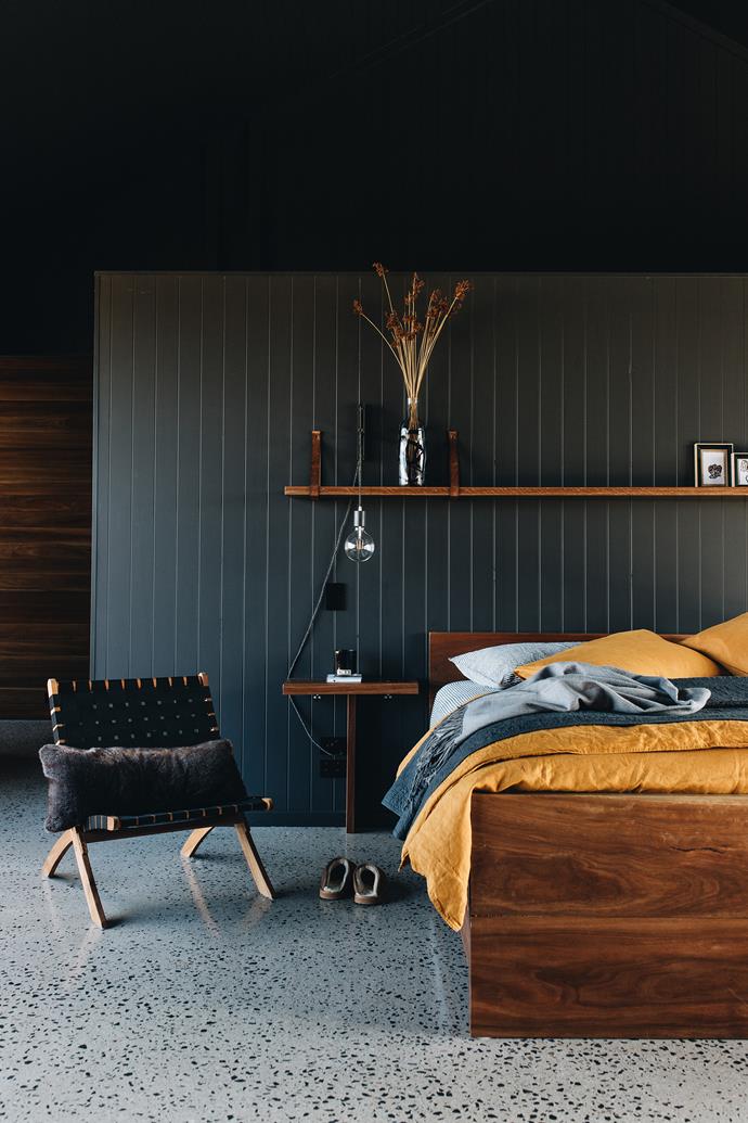 A deep colour scheme may not be for everyone, but Kerry and Peter Johnson knew speckled concrete flooring and dark hues were right for their [dream home just outside of Boorowa, NSW](https://www.homestolove.com.au/contemporary-farmhouse-dark-interior-21657|target="_blank"). Living on a 900-hectare farm means they needed a home that could handle the dust and mud that comes with country life. The pair designed and built the bed frame and Kerry even created the lamp herself. For similar bedding, try the Tumeric 100% flax linen duvet cover from [Bed Threads](https://bedthreads.com.au/products/turmeric-100-flax-linen-duvet-cover|target="_blank"|rel="nofollow").