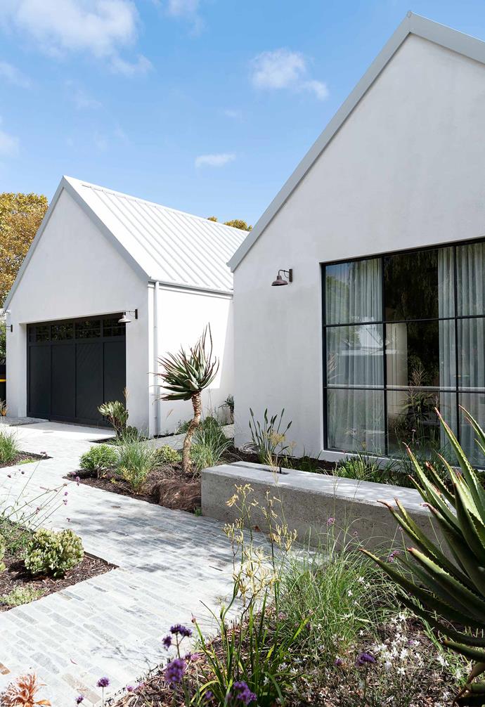 **Exterior** Lush green plantings form a vibrant contrast to the stark white exterior of the house.