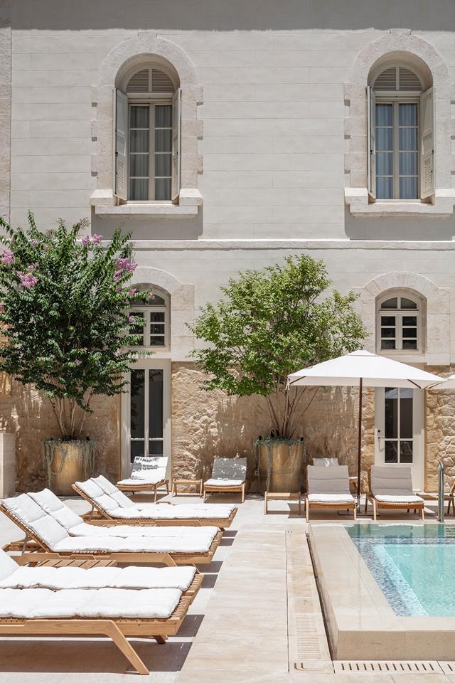 In the former [French hospital in Jaffa](https://www.homestolove.com.au/the-jaffa-hotel-hospital-conversion-19300|target="_blank"), the an ultra-luxury hotel blends the old and new with an idiosyncratic vibe, and a contemporary swimming pool shaded by large potted trees and historic resort rooms.