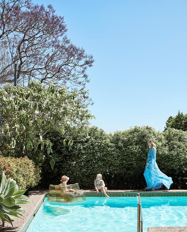 While homeowner Lill entertains guests poolside at their [timeless modernist home](https://www.homestolove.com.au/modernist-home-architect-peter-hall-19918|target="_blank"). Photo: Maree Homer | Styling: Kristin Rawson | Story: Real Living