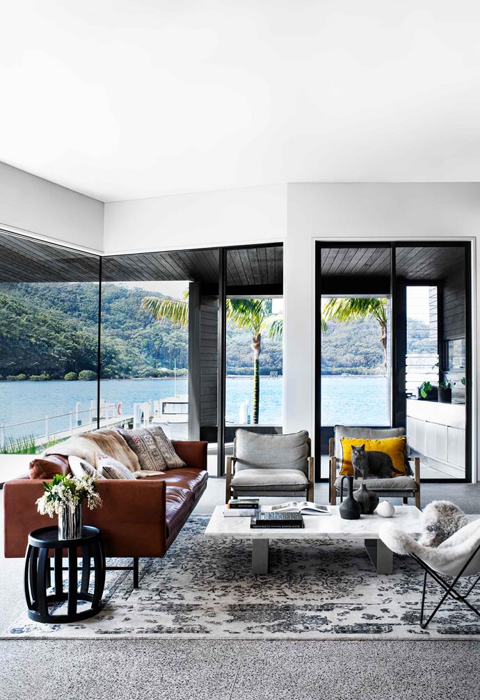 Sleek furniture with contemporary lines add a rich textural element to the living room of this [modern home in Booker Bay](https://www.homestolove.com.au/modern-house-booker-bay-20437|target="_blank").