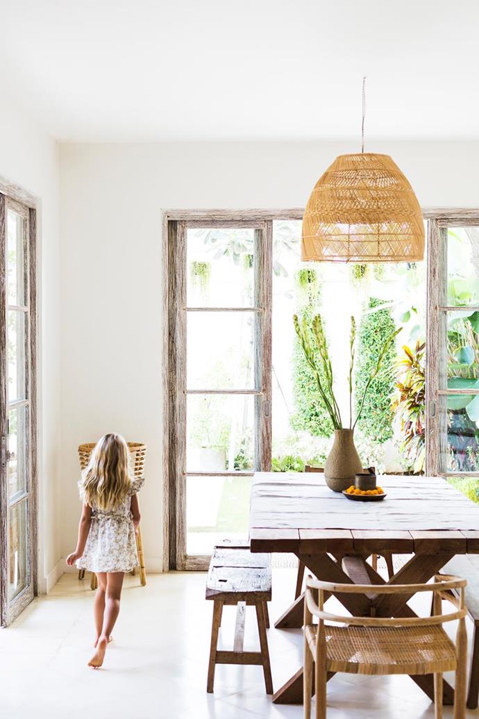 Woven pieces, rattan chairs and handmade baskets, add lightness to the dining room in [Yoli & Otis founder's sustainable Bali home](https://www.homestolove.com.au/yoli-and-otis-bali-home-19838|target="_blank") and offset heavier items like the table and bench seats.