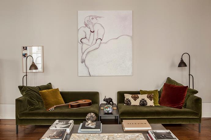 This modular Molteni&C 'Paul' sofa is covered in an opulent olive fabric by Marta. The artwork is by the Sofia Cacciapaglia. Mixed palette Marta's style isn't confined to one era. The Indian teak columns, wicker chaise, robust sofa and contemporary art by Marco Petrus create a sense of timelessness in the living room.