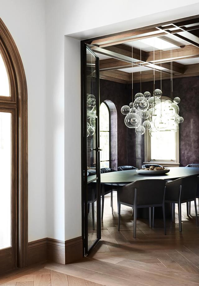 A thread of elegant understatement is woven throughout this [heritage home](https://www.homestolove.com.au/heritage-property-fashioned-into-elegant-house-20094|target="_blank") in Sydney's eastern suburbs, reflecting the predilections of its fashion designer owner. The walls of the formal dining room are finished in deep grape-coloured stucco lustre.