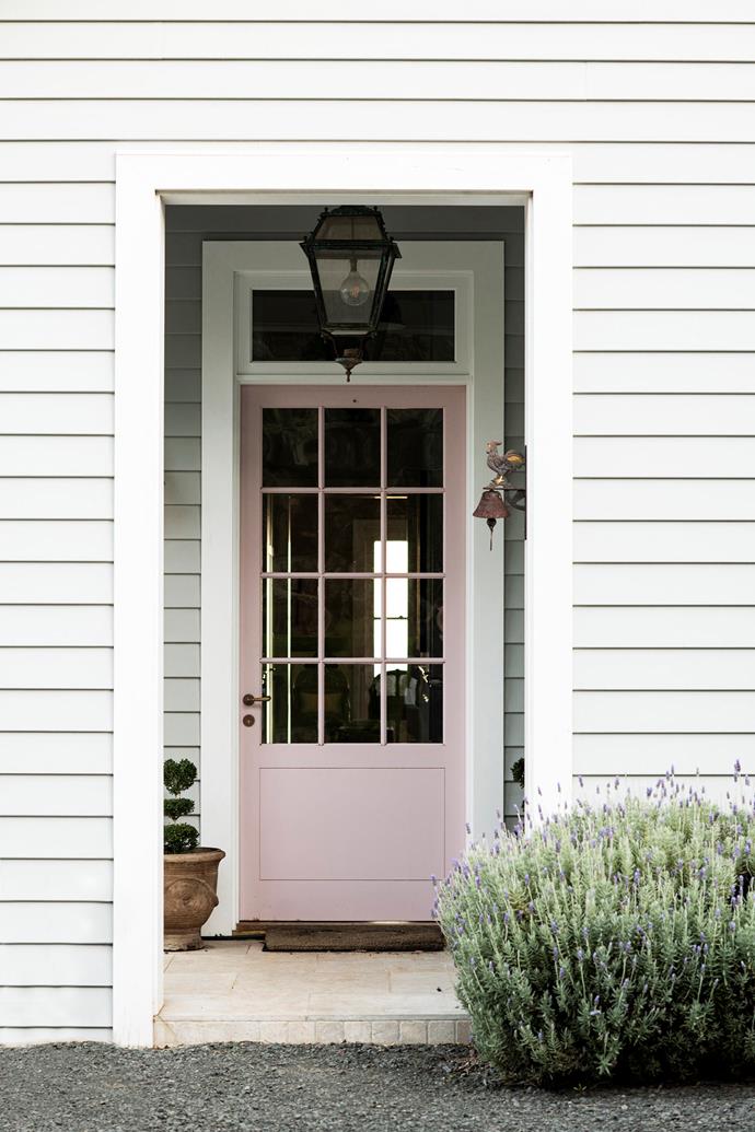A lavender bush provides a fragrant entrance.