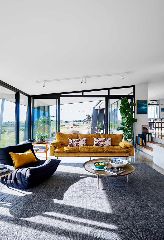 **Living area** Plenty of seating can be found on the family's Togo armchair by [Ligne Roset](https://www.domo.com.au/brand/ligne-roset/|target="_blank"|rel="nofollow") and four-seater Retro velvet sofa in Ochre by [HK Living](https://www.hkliving.com.au/|target="_blank"|rel="nofollow"), through [House Of Orange](https://www.houseoforange.com.au/|target="_blank"|rel="nofollow"). Gold cushion by Nathan + Jac, supplied by [Because Of Jonny](https://www.instagram.com/becauseofjonny/?hl=en|target="_blank"|rel="nofollow").