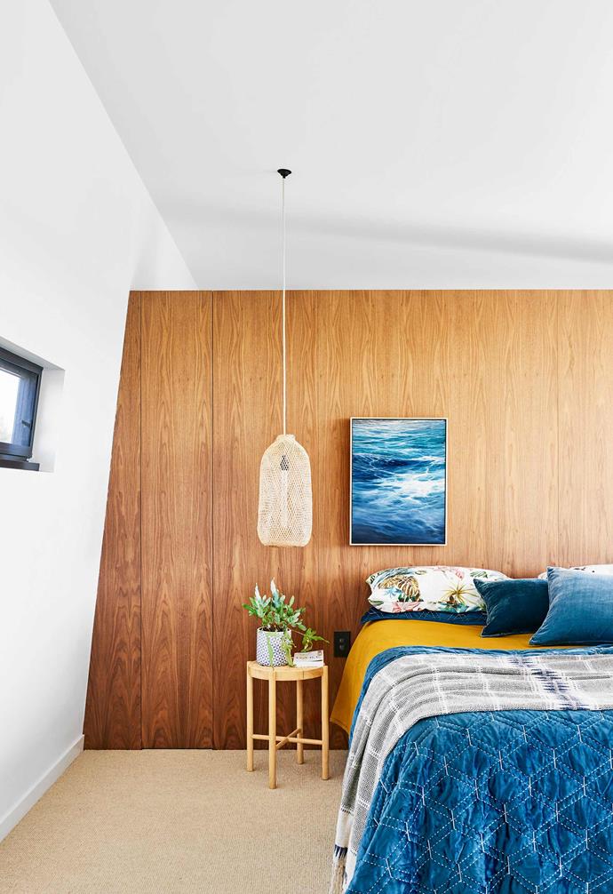 **Main bedroom** The walnut-veneer 'bedhead' is actually joinery wrapping around the ensuite and robe. Personal touches abound, including a fish trap that Shane sourced in Thailand and turned into a lamp shade. Coverlet and throw, [Adairs](https://www.adairs.com.au/|target="_blank"|rel="nofollow"). Nathan+Jac velvet cushions, [Because Of Jonny](https://www.instagram.com/becauseofjonny/?hl=en|target="_blank"|rel="nofollow"). Artwork by Nat.