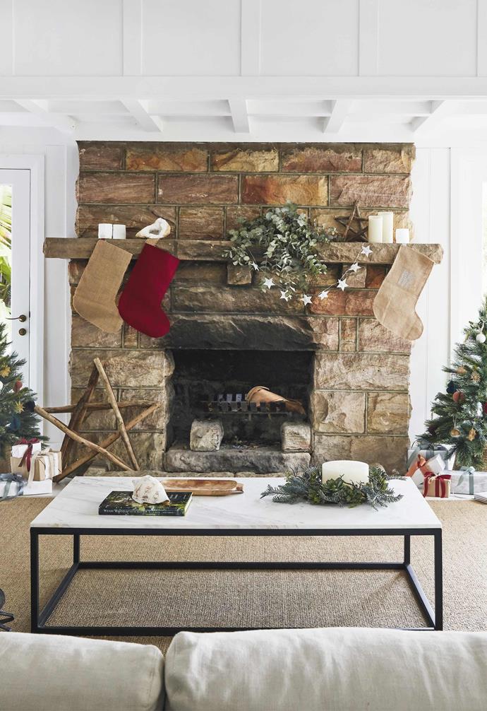**Living area** The imposing stone fireplace and impressive timber mantel are the perfect spot for a seasonal display including homemade Santa sacks and driftwood stars from Delight Decor. The sofa, from [MCM House](https://mcmhouse.com/|target="_blank"|rel="nofollow"), is large enough to seat a crowd. On the MCM House marble and metal coffee table is a chestnut wreath and three-wick candle from [Papaya](http://papaya.com.au/|target="_blank"|rel="nofollow").