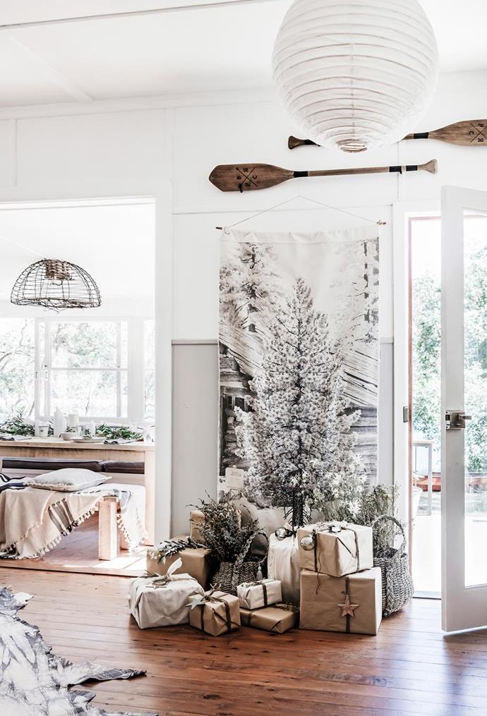 Placing a Christmas tree close to the front door will immediately set the mood.