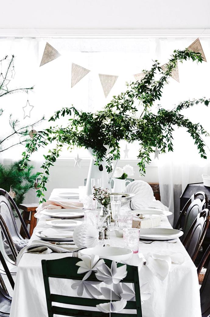 Greenery adds a pop of festive colour to this table that wholeheartedly embraces the White Christmas theme.