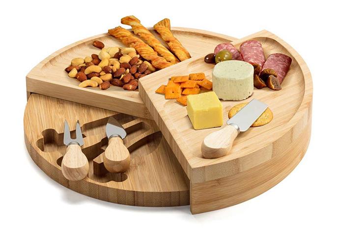 **[Ovela Round Bamboo Cheese Board Set, $29.99, Kogan](https://www.kogan.com/au/buy/ovela-round-bamboo-cheese-board-set/|target="_blank"|rel="nofollow")**<br>
With three tiers, this is the ultimate board for feasting. Create a visual centrepiece by piling decadent antipasto ingredients and allow your guests to graze.