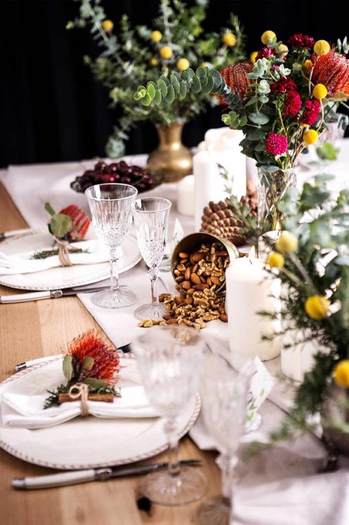 Native flowers are a beautiful and sustainable way to bring in warm tones to your home. On this table bottle brush is a chic napkin decoration, and paired with native greenery and white linen napery, introduce colour to this stylish [Christmas table setting](https://www.homestolove.com.au/christmas-table-setting-steps-16141|target="_blank").