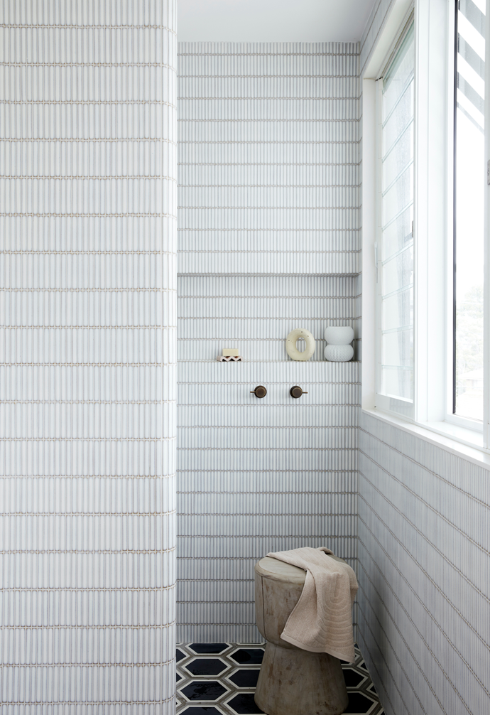 The bathroom wall tiles were inspired by the design of a local public bathroom, and Rhiannon first spotted these floor tiles on Instagram. The soap dish is from Fazeek and the soap and hand towel are from Oliver Thom.