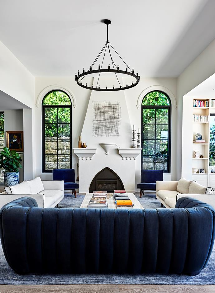 Commanding and luxurious with a vintage vibe, the centrepiece of this living room has to be the original arched fireplace, which announces its Spanish heritage. The rest of the home, a [restored 1920s villa](https://www.homestolove.com.au/restored-1920s-meditteranean-villa-22124|target="_blank"), runs along the same vein, with curves in all the right places.