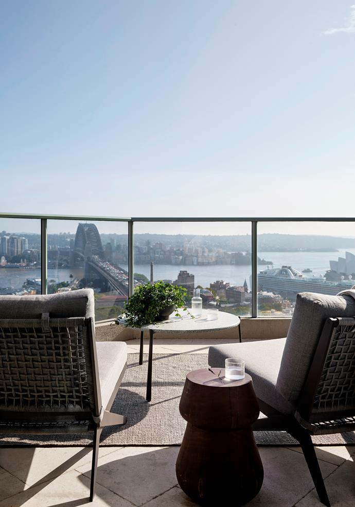 "It was important to layer the light and introduce shadow, softening the boundary between outside and in," says architect Felicity King of the Sydney apartment, in which emerald and teal tones link to harbour views. On the balcony, 'Loop' wicker chairs from Harbour Outdoor, Tribù 'Branch' table from Cosh Living, recycled timber 'Stanley' stool from Jardan and 'Tide' rug from Armadillo.