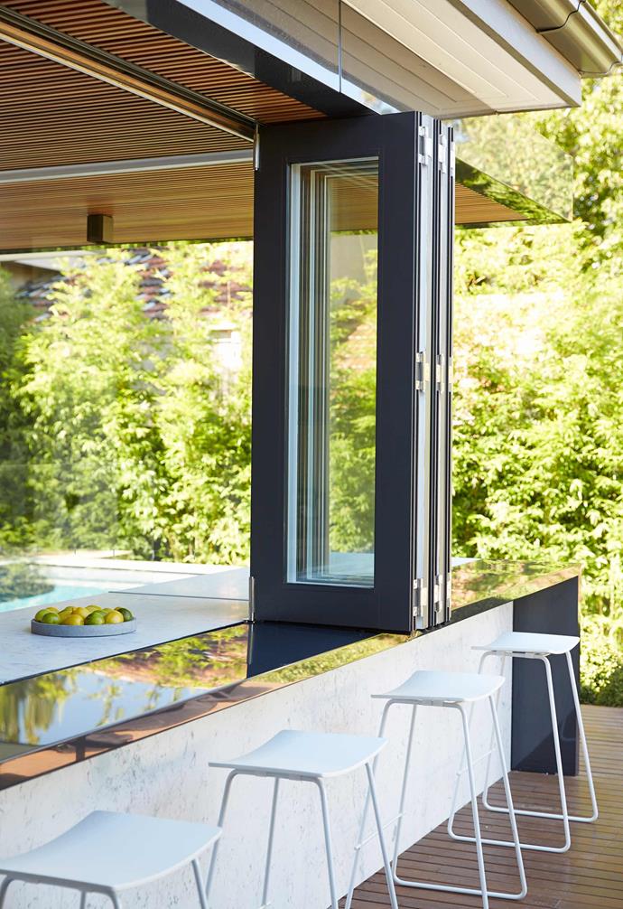 **Bifold Bliss** Stainless-steel bifold windows from Stegbar make a seamless connection between in and out for entertaining ease.