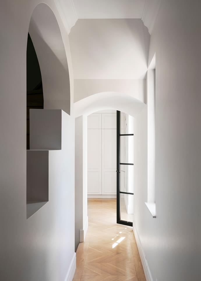 The home's ornate architraves, ceilings and angular details were retained, with new steel-framed doors and a bright white paint scheme bringing a contemporary edge.