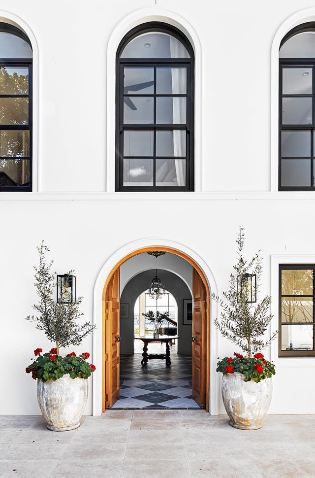 This stunning [1920s villa](https://www.homestolove.com.au/restored-1920s-meditteranean-villa-22124|target="_blank") could be sitting on the coast of the Mediterranean. A high double-oak front door is flanked by two large pots filled with red geraniums and centred with olive trees.