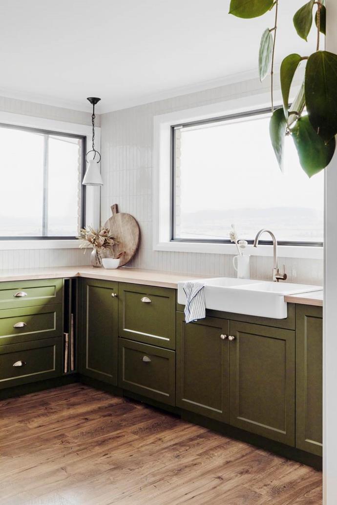 Tying this kitchen's scheme together is the Shaker-style joinery, painted jungle green. "We explored various tones of green before settling on this one, Dulux Amazon Depths, which works beautifully with the timber benchtops," says designer Lydia Maskiel.