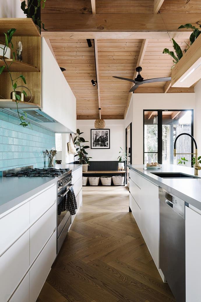 Teal was the binding colour of this kitchen renovation. Eye-catching splash-back tiles and a blue-grey hued kitchen benchtop bring fresh life and warmth to the [modern, open-plan home nestled in bushland](https://www.homestolove.com.au/modern-open-plan-bush-home-21993|target="_blank"). 