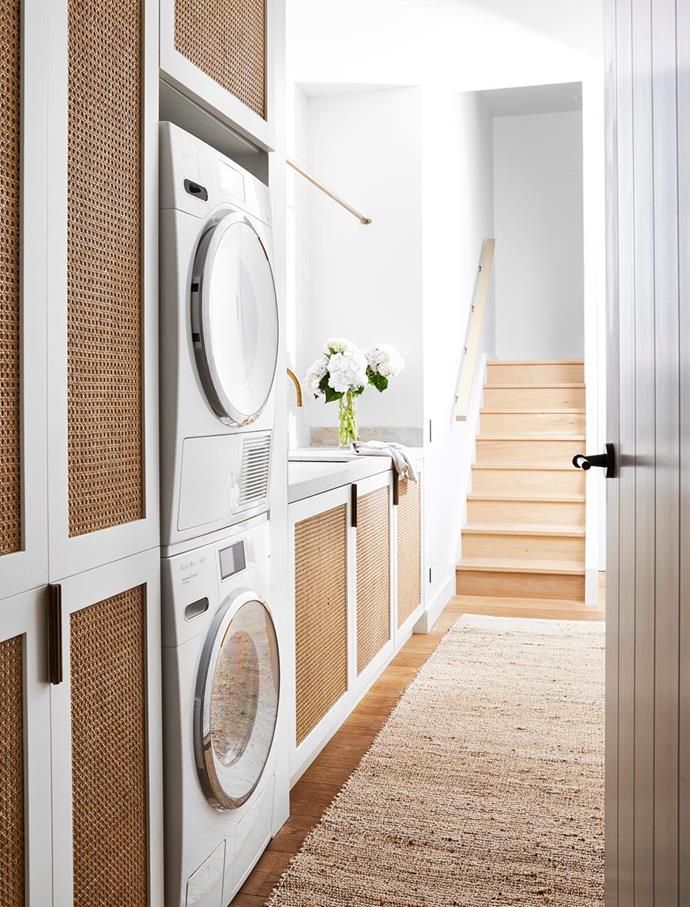 Custom laundry joinery by Hugh-Jones Mackintosh in warm rattan tones create a luxurious laundry space in this [casually sophisticated home with a connection to the outdoors](https://www.homestolove.com.au/casually-sophisticated-home-connected-to-the-outdoors-22216|target="_blank"). 