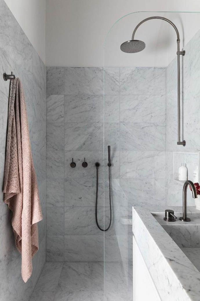 For continuity in this chic bathroom, Alexandra Donohoe of Decus specified the same Carrara marble for the floor tiles, wall tiles and vanity top, with the base colour matched to the paint on the joinery units and walls.