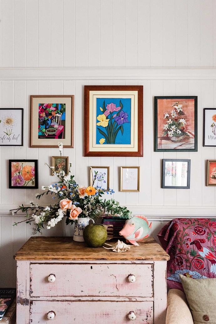 This sweet, shabby chic gallery is one for those who are too scared to commit to a full wall of colour. Floral prints and vintage finds are brought together with a palette of pink, red, orange and blue in the living room of this [grandmillenial pink cottage](https://www.homestolove.com.au/grandmillennial-pink-cottage-22384|target="_blank") in Toowoomba.