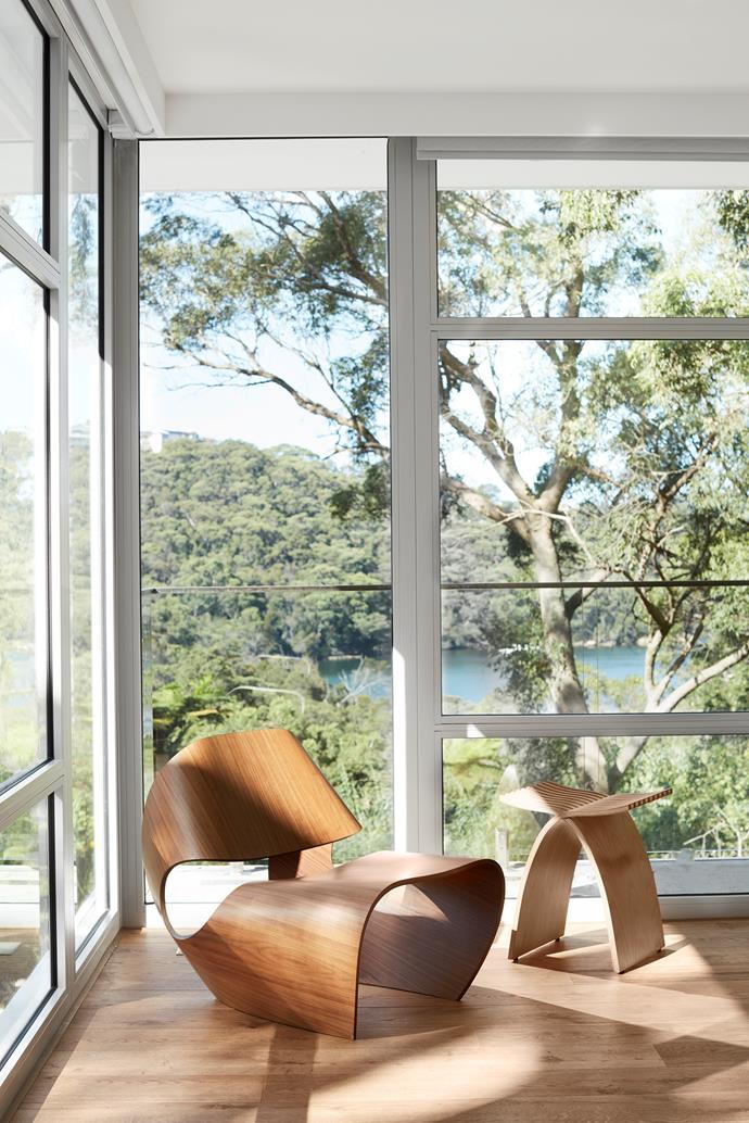 With their organic forms and materials, the Made in Ratio 'Cowrie' chair by Brodie Neill and Herman Miller 'Capelli' stool by Carol Catalano, both from Living Edge, sit perfectly at ease against the natural backdrop.