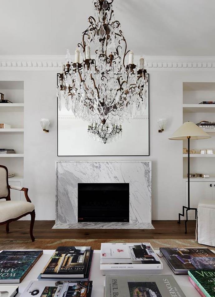 Phoebe Nicol created bespoke pieces in the living and reading room of this [French-inspired home](https://www.homestolove.com.au/elegant-home-french-inspired-interior-sydney-22184|target="_blank"), including a hand-knotted rug, ottoman, mirror and fireplace surround in Statuario marble.
