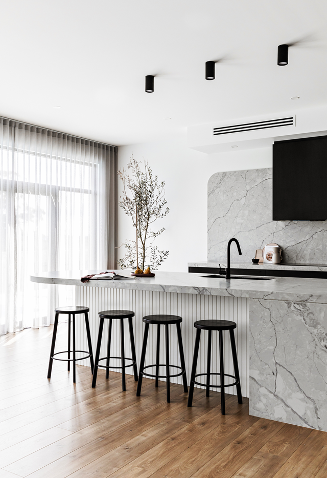 This [striking contemporary kitchen](https://www.homestolove.com.au/contemporary-family-new-build-sydney-22465|target="_blank") has a sleek, monochrome palette so matte black tapware is only fitting. A matching black sink is under-mounted to keep sightlines clean and benchtops clear.