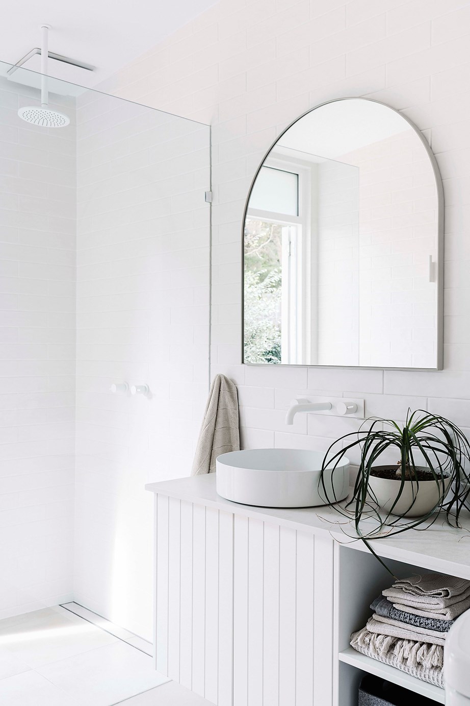 Heated flooring and a door that opens directly onto the backyard make this the perfect bathroom in [this airy beach shack in Flinders](https://www.homestolove.com.au/renovated-mid-century-modern-beach-shack-flinders-22501|target="_blank"), VIC. *Photo: Marnie Hawson / Story: Country Style*