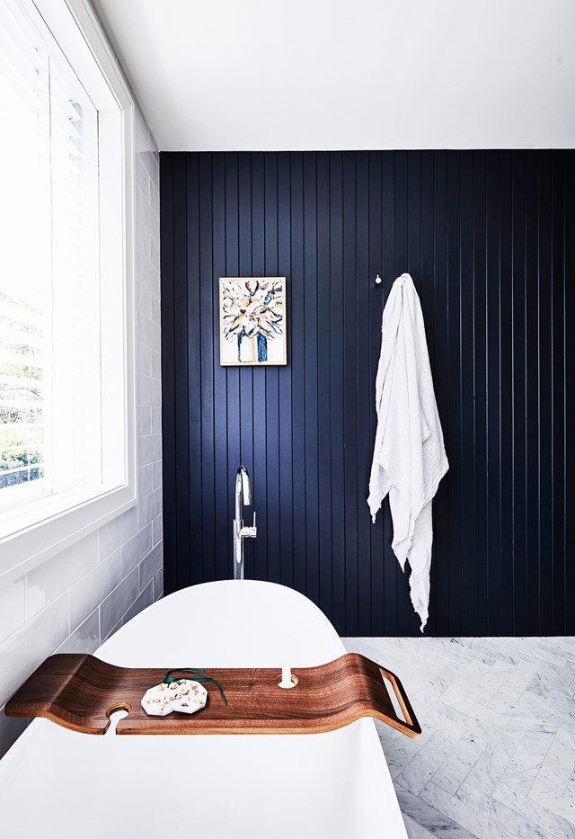 A feature wall of VJ panelling references other rooms to create a cohesive design palette in [this reimagined bathroom](https://www.homestolove.com.au/classic-bungalow-north-shore-sydney-22542|target="_blank").