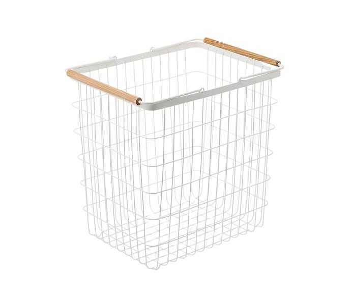 [**'YAMAZAKI' Tosca wire laundry basket in white, $94 (large), DesignStuff**](https://www.designstuff.com.au/product/yamazaki-tosca-laundry-wire-basket-large-white/|target="_blank"|rel="nofollow")
<br></br>
If you're only doing laundry for one, skip the plastic and opt for a wire basket like this one from DesignStuff. Designed in Japan, it features an airy frame made from powder-coated steel and a set of wooden handles.