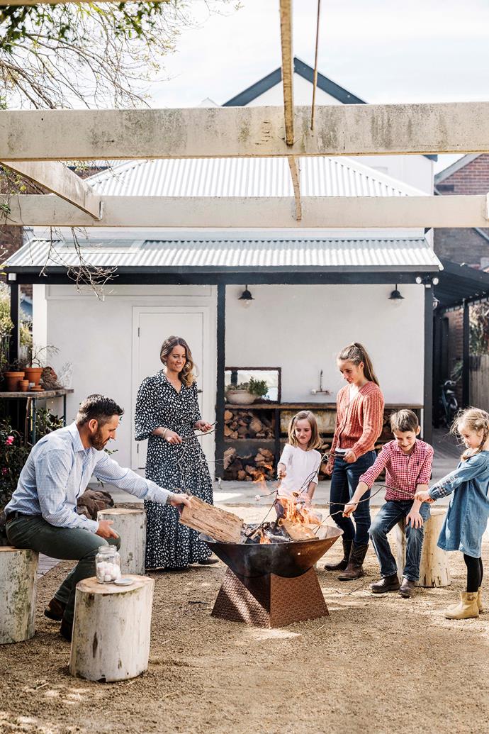 The family toasts marshmallows over the fire pit, which is from local Crookwell store Ensemble & Co.