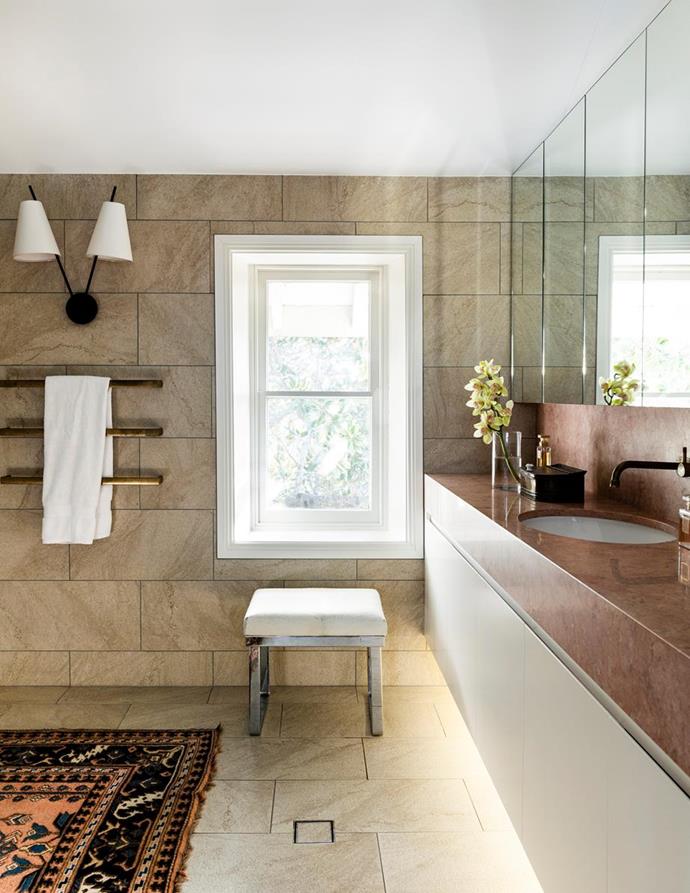 "I took great pains to select a marble to work with the mantel in the main bedroom," said the owner of this [iconic Sydney sandstone home](https://www.homestolove.com.au/sydney-sandstone-home-7150|target="_blank"). Like its exterior, the bathroom embraces natural materials, with a vanity surface in Rosso Daniel marble and travertine tiles on the floors and wall.