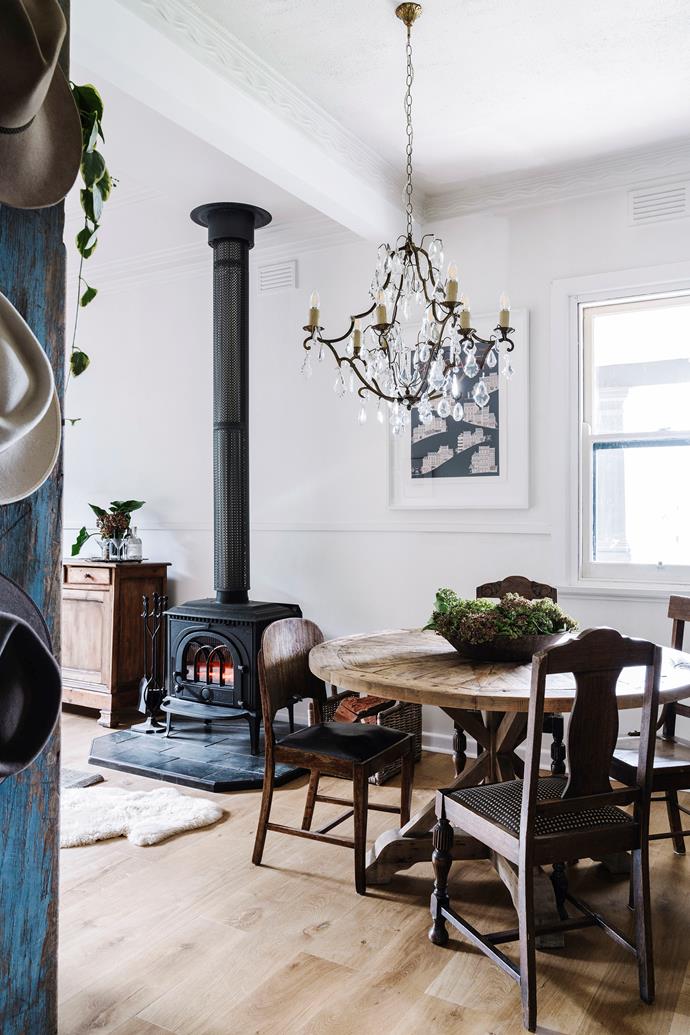 The hero of this open-plan dining space at a [farmhouse in Molyullah, VIC](https://www.homestolove.com.au/1950s-farmhouse-makeover-22829|target="_blank") is the Jotul wood stove which keeps the space cosy even in the depths of winter. "Opening up the living and kitchen areas to create one room just made such a difference," says homeowner Bec MacDougall.