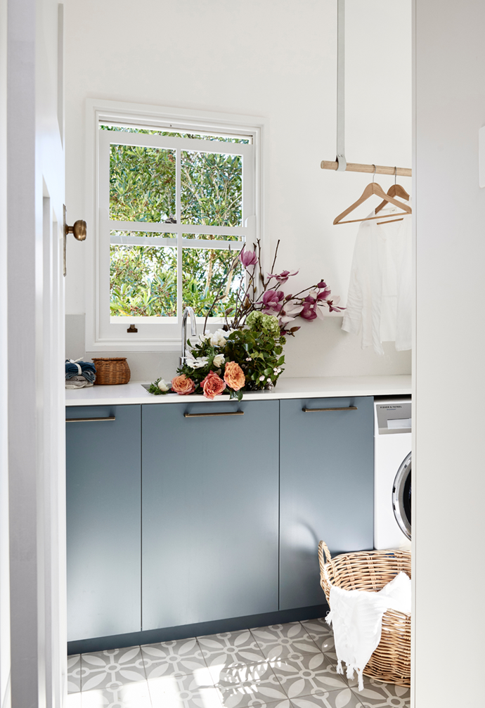 Customised cabinetry doors in Laminex Winter Sky conceal appliances and storage and spruce up the laundry in this [heritage Sydney home](https://www.homestolove.com.au/restored-heritage-home-sydney-21929|target="_blank"). 