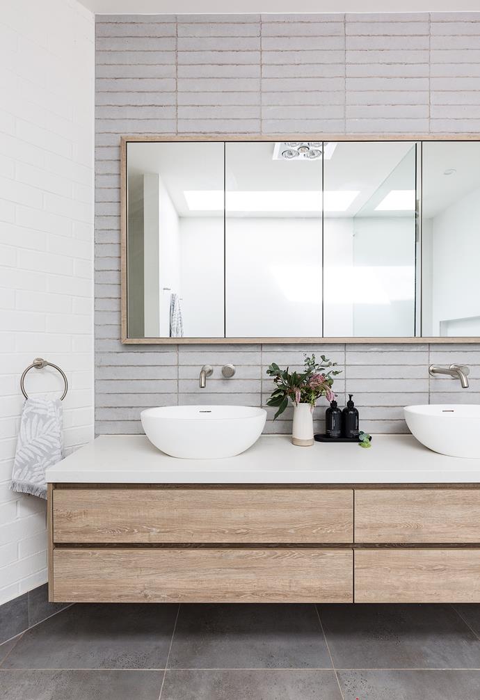 A contemporary bathroom in a [home designed by Oak and Orange](https://www.homestolove.com.au/palm-springs-new-build-sydney-22838|target="_blank") featuring square tiles laid in a grid pattern.