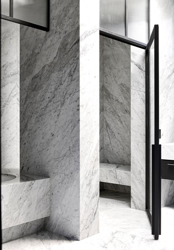 The ensuite is clad in Carrara marble from Peraway Marble.