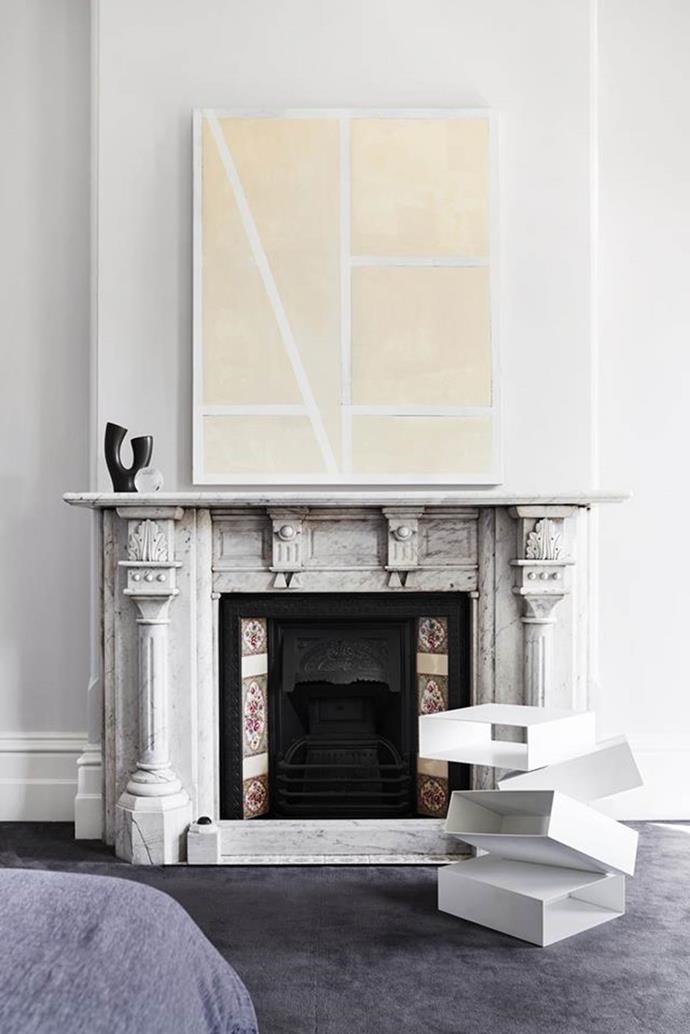 Studio 103 revamped [this Victorian terrace](https://www.homestolove.com.au/a-victorian-terrace-gets-a-contemporary-revamp-6624|target="_blank") while respecting the original period features. An artwork by Antonia Sellbach hangs above the grand fireplace. File this under: contemporary cosy. 

*Photographer: Marsha Golemac*