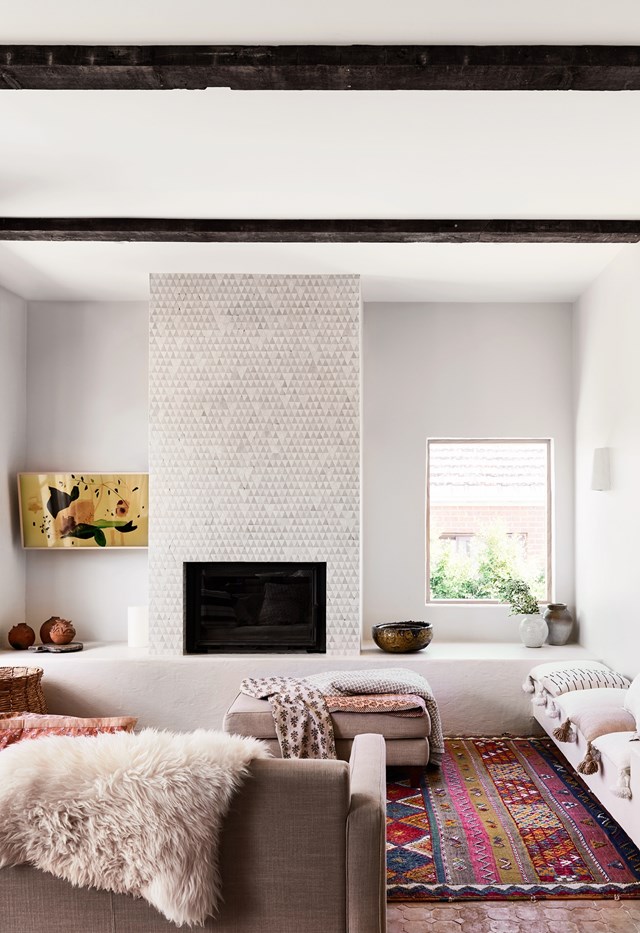 In this living room, the fireplace divides up the space and gives the room structure without compromising that open-plan feel.