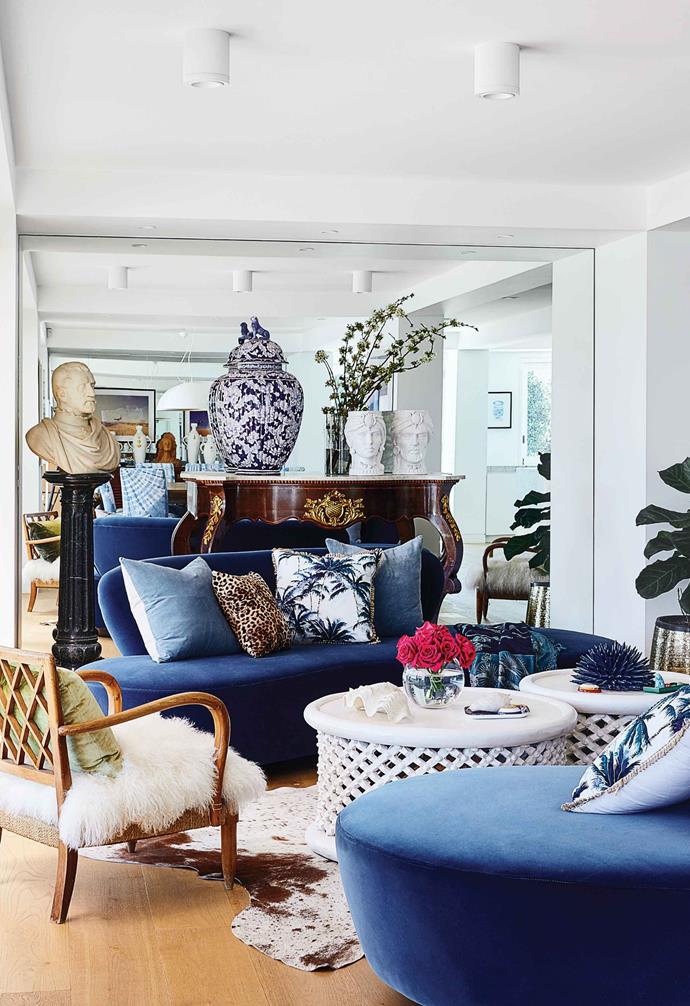 Curvy lounges by BKH Interiors anchor the refined space Sara calls her "ladies' lounge". The room showcases pieces that speak to her Sicilian heritage and passion for art and travel, such as a 19th century Louis Philippe console and a blue and white Faenza vase from Italy. The armchair (resting on a cowhide rug from NSW Leather Co) is an Art Deco piece that belonged to her grandmother. "I love mixing antique, modern and contemporary pieces," says Sara.